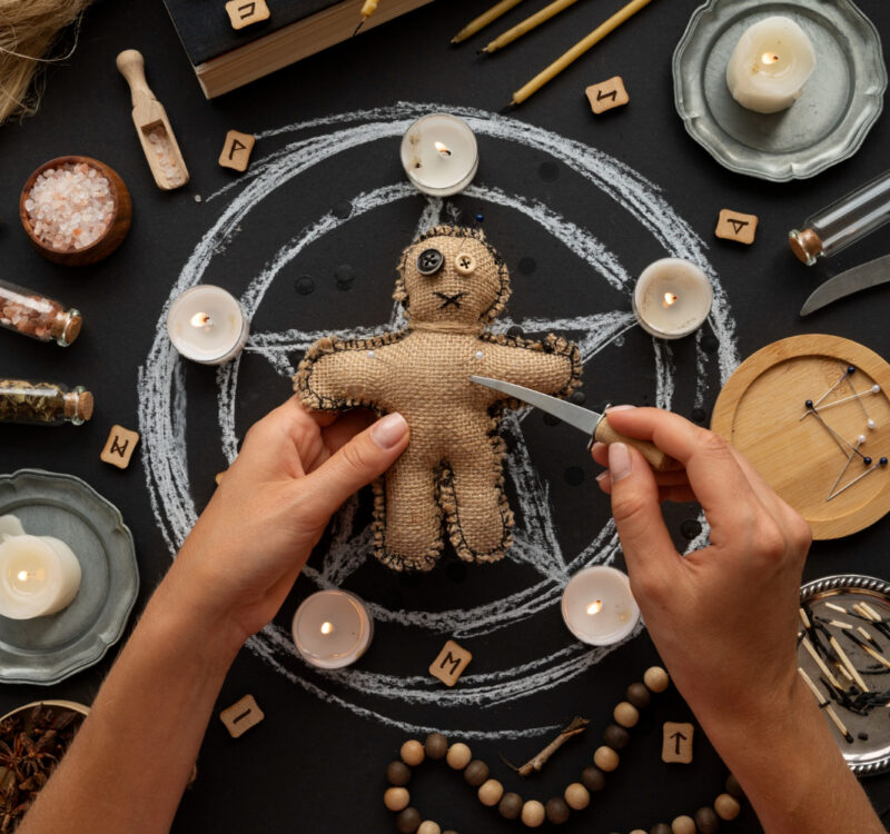 above-view-voodoo-doll-and-candles