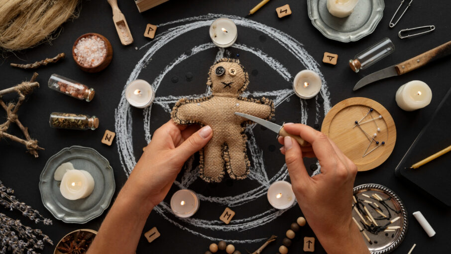 above-view-voodoo-doll-and-candles